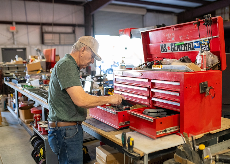 WVGC employee finding tools in a tool box